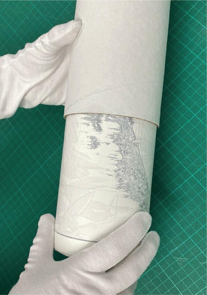 Maps wrapped in protective tubing for Denise Map Art